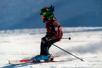 Cute Child Skiing Down the Slope