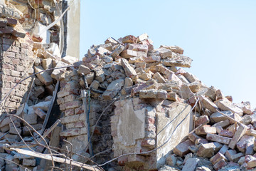 Ruined building. A pile of concrete, rubble and reinforcement debris.