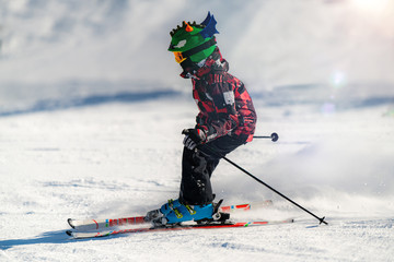 Cute Child Skiing Down the Slope