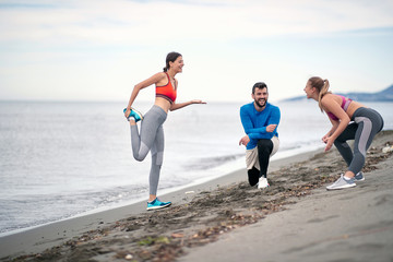 Group of friends stretching together; Active lifestyle
