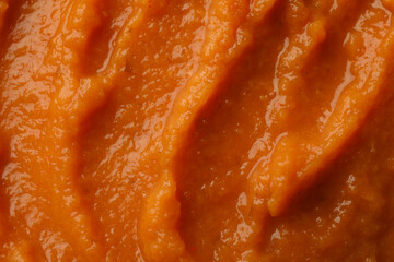 Pumpkin puree on whole background, close up