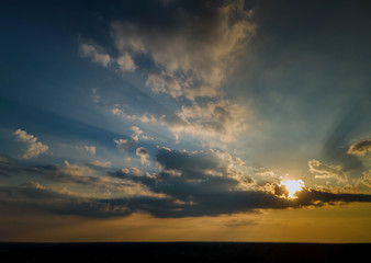 Colorful dramatic sunrise with clouds sky bright horizon burning skies