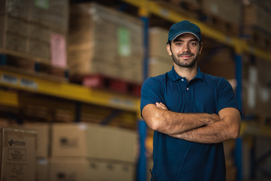 Male warehouse worker portrait in warehouse storage