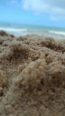 Fototapeta na wymiar sand beach with blue sky