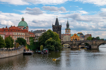 Fototapeta premium View of Charles Bridge, the Old Town Bridge Tower and the Basilica of St. Francis of Assisi. Prague, Czech Republic