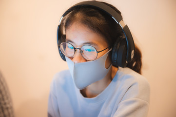 Remote work during epidemic. Woman working from home with the concept of new normal lifestyle