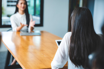 two people talking on table and keep distance, social distancing concept