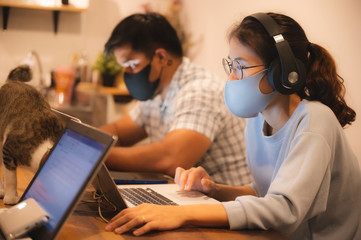 Remote work during epidemic. Woman working from home with the concept of new normal lifestyle