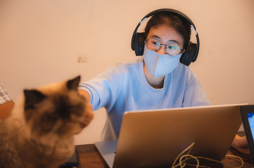 Remote work during epidemic. Woman working from home with the concept of new normal lifestyle