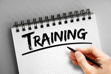 Training text on notepad, business concept background