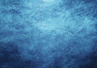 abstract blue background or dark texture with bright center spotlight 