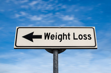 Weight Loss road sign, arrow on blue sky background. One way blank road sign with copy space. Arrow on a pole pointing in one direction.