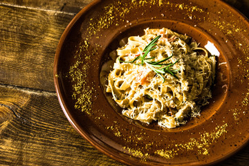 Delicious italian pasta on wooden background