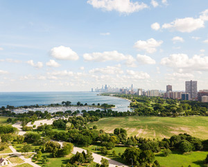 Aerial View of the Chicago City Skyline over the Urban Neighborhoods During the Day
