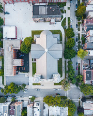Aerial View of the Chicago Church over the Urban Neighborhoods During Sunset
