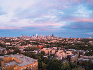 Aerial View of the Chicago City Skyline over the Urban Neighborhoods During Sunset
