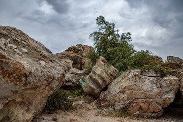 rocky steppe landscape on the background of a cloudy sky with clouds