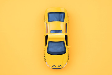 Yellow taxi car on a yellow background. Taxi
