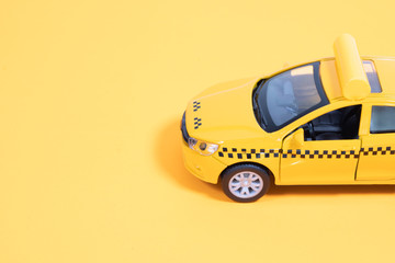 Yellow taxi car on a yellow background. Taxi