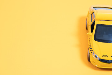 Yellow taxi car on a yellow background. Taxi