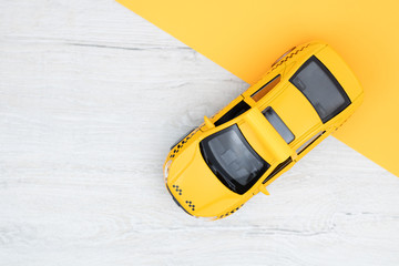 Yellow taxi on a light background. Taxi