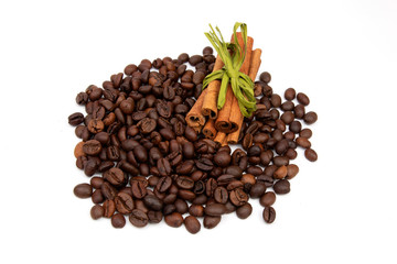 Coffee beans with cinnamon sticks on a white background