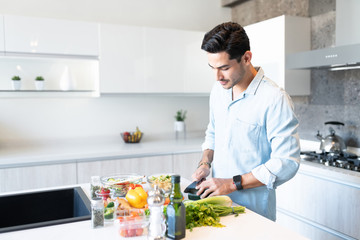 Latin Man Preparing Food At Home