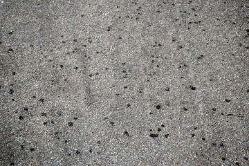 Black and white rough cement wall texture with small holes. A beautiful pattern