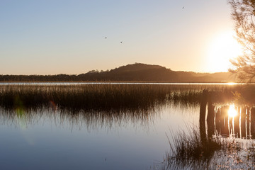 Fototapeta premium Sunrise over the calm lake