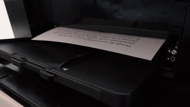 black printer prints sheets of paper