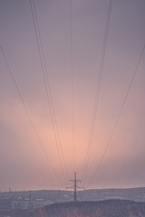 high voltage power line in sunset