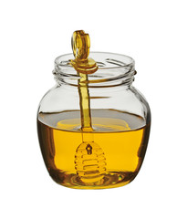Glass jar with honey and a plastic transparent dipper for honey. Isolated on a white background