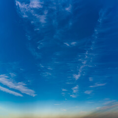 Fantastic soft clouds against blue sky, natural composition