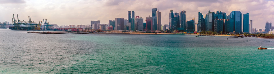 Obraz premium A panorama view from the Singapore Straits towards the port and financial district of Singapore, Asia