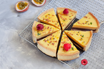 Pie with chocolate cream and passionfruit, decorated with raspberry