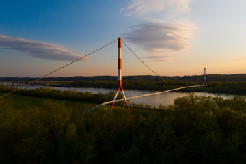 This is a sunset view of a natural gas pipeline suspension bridge that spans the Ohio River between Ohio and Kentucky.