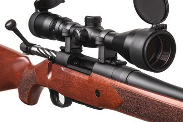 A sniper rifle with a telescopic sight. A carbine with a wooden stock. Weapons for hunting and sports isolate on a white back.