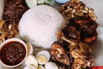 Plate of rice with meat and sauces with different species