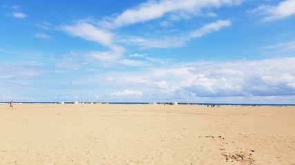 Family time leisure travel to sandy beach in Valencia Spain Europe on a bright sunny weekend.