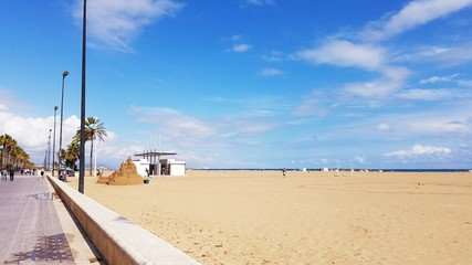Leisure travel to sandy beach Valencia Spain Europe under a bright blue sky. Family time. 