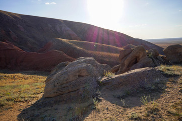 Big Bogdo mountain. Red Sandstone outcrops on the slopes of the sacred mountain in the Caspian...