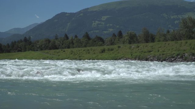 Cascades of the young Alpine Rhine river in the Principality of Liechtenstein in the European Alps