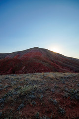 red sandstone outcrops on the slopes of Big Bogdo sacred mountain in Caspian steppe Bogdo-Baskunchak nature reserve, Astrakhan region, Russia