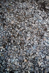 The texture of the stones lying on the ground.
