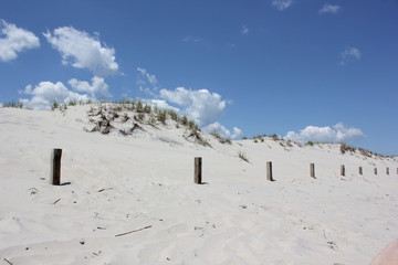 White sand dunes. Sunny day at the beach