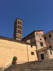 Italian yellow houses and a bell tower in Rome