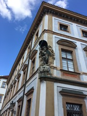 Italian building traditional facade with sculpture  