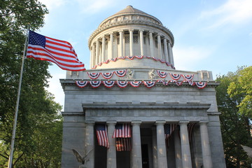 American flag waving next to the Memorial Capitol