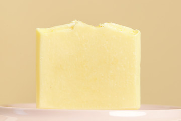 Handmade castile soap bar  close up. Homemade toxic-free natural organic cosmetic.
