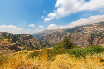 Fototapeta na wymiar Panoramic view of the Kadisha Valley in Lebanon. The Holy Valley is the place of the ancient Christian community. Beautiful Lebanese mountain landscape